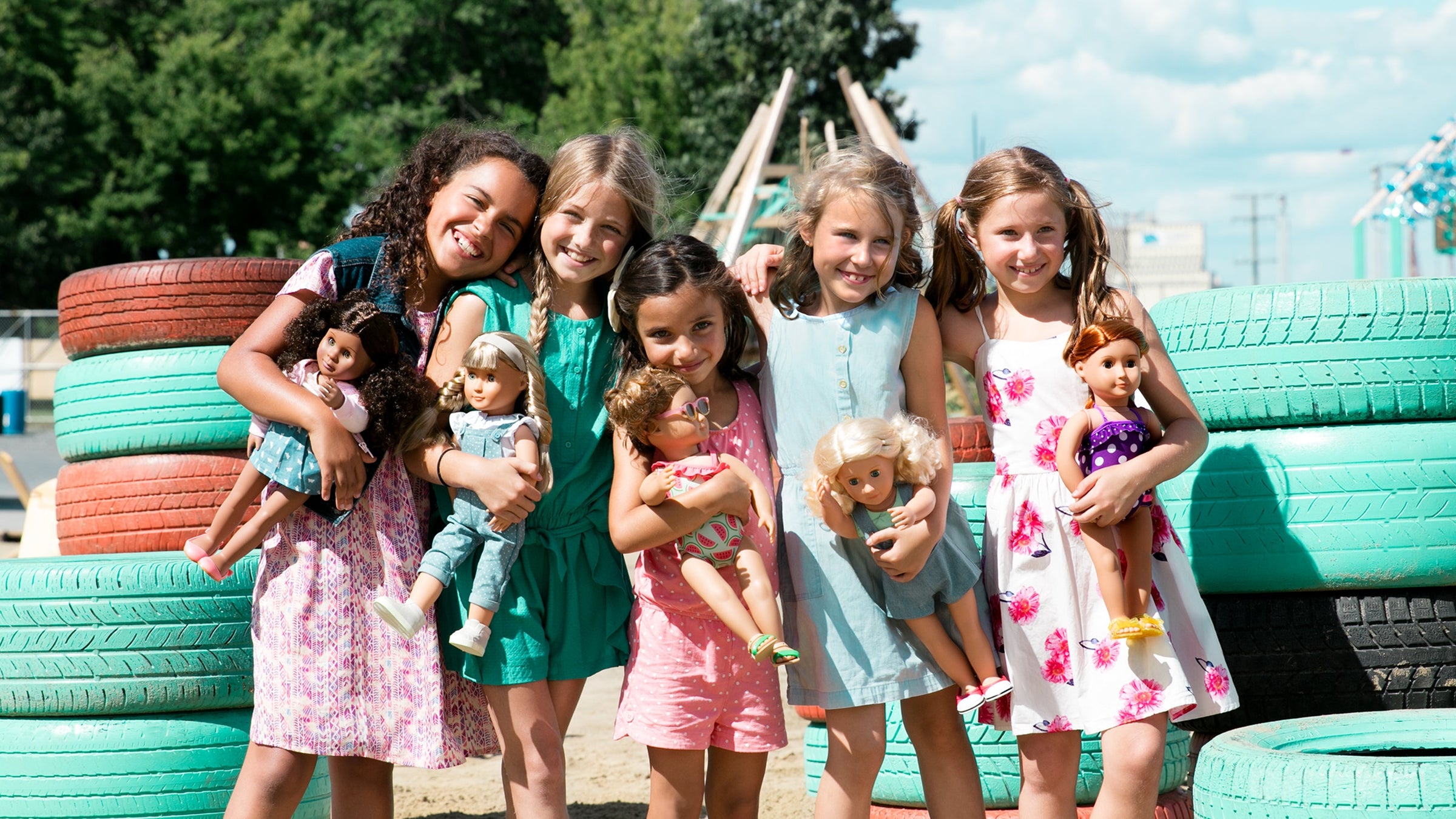 Diverse Group of young Girls playing with Dolls