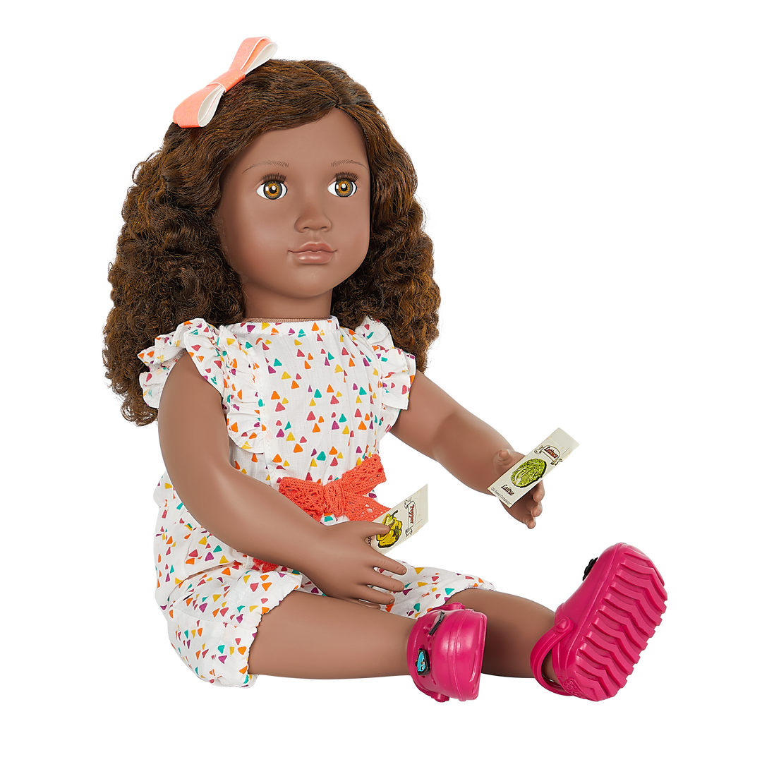 18-inch doll with brown hair, hazel eyes, gardening accessories and storybook