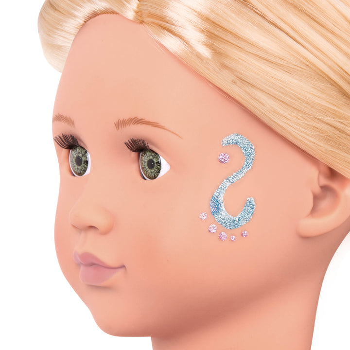 18-inch doll with blonde hair, green eyes and glitter tattoo decals
