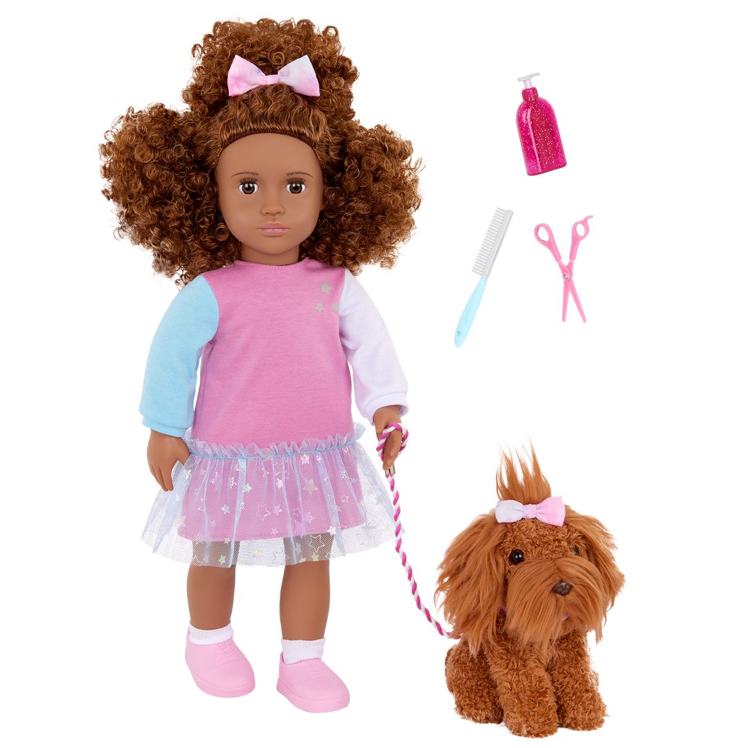 Our Generation Safie & Ginger a 18 inch doll with brown hair and brown eyes with a brown barbet pup