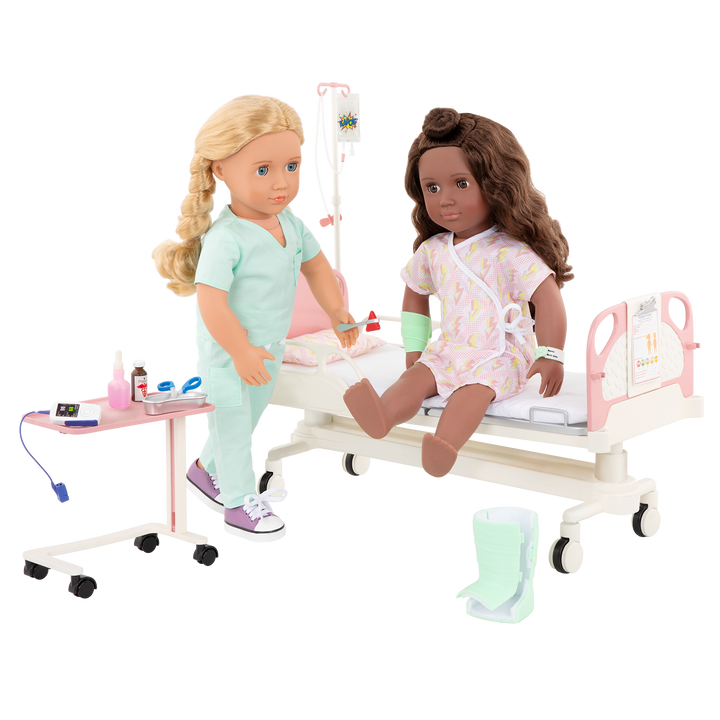 Two 18-inch dolls with hospital gurney playset