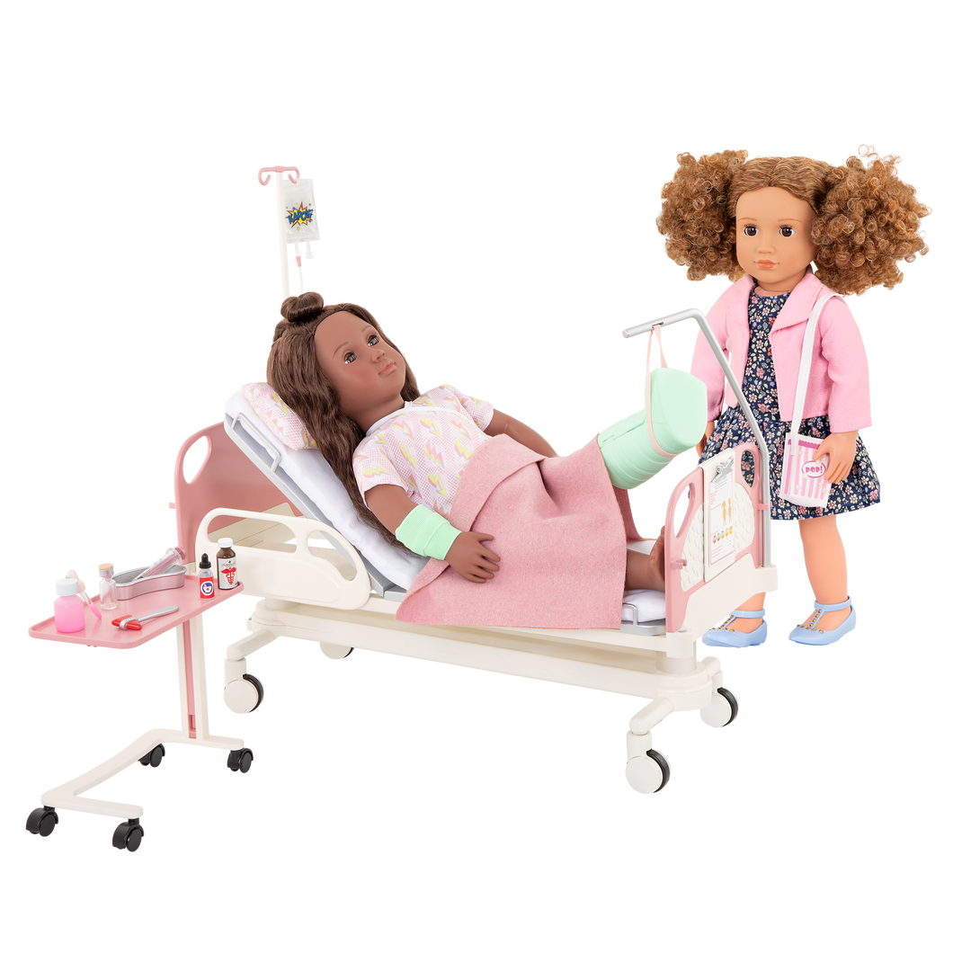 Two 18-inch dolls with hospital gurney playset